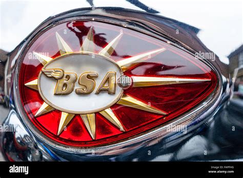 Close up of gold and red BSA emblem. BSA embossed on shooting star ...