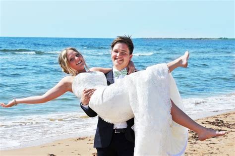 Love The Groom Lifts His Bride As They Kiss Stock Photo Image Of