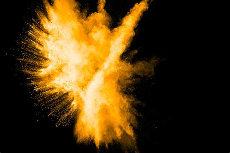 Deep Yellow Color Powder Explosion Cloud Isolated On White