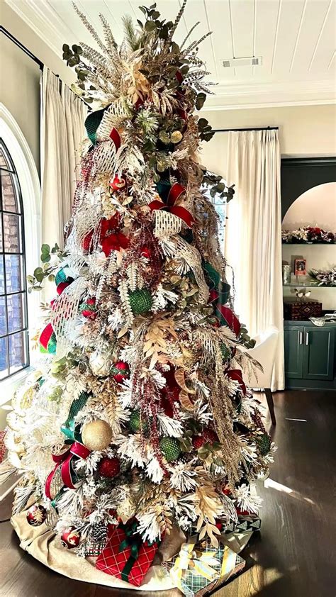 Elegant White Christmas Tree Decorated With A Traditional Red Green