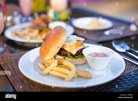 Burger And Fries On White Plate For Lunch Stock Photo Alamy