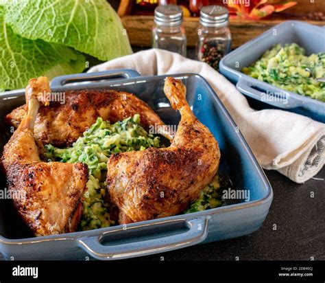 Roasted Chicken Legs With Potatoes And Vegetables Stock Photo Alamy