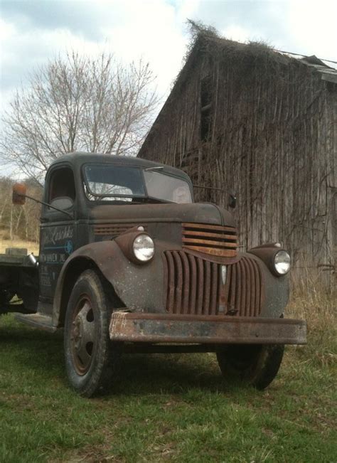 Shabby Old Truck And Barn Covered In Vines Old Trucks Trucks Chevy Trucks