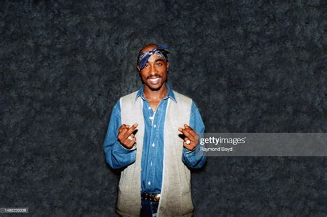 Rapper Tupac Shakur poses for photos backstage after his performance ...