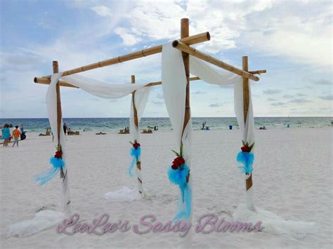 Bamboo Arbor With White Sheer Red Roses And Turquoise Bows For A