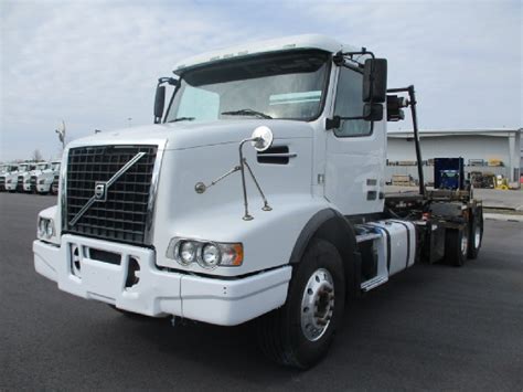 2012 VOLVO VHD64B200 ROLL OFF GARBAGE TRUCK FOR SALE 1369