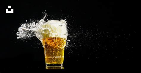 A Glass Of Beer With A Splash Of White Liquid Photo Free High Speed Photography Image On Unsplash