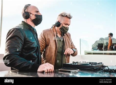 disc jockeys playing   tourist people  club party outdoor