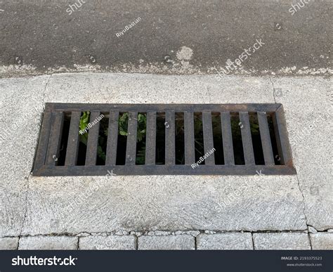 Rainwater Grate On Sidewalk Draining Water Stock Photo 2193375523 ...