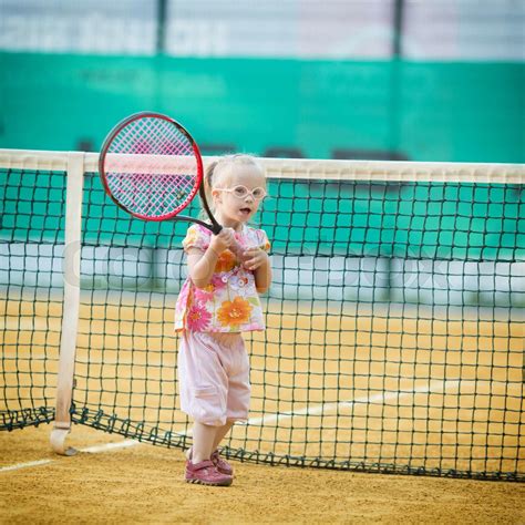 beautiful girl with Down syndrome playing tennis | Stock image | Colourbox