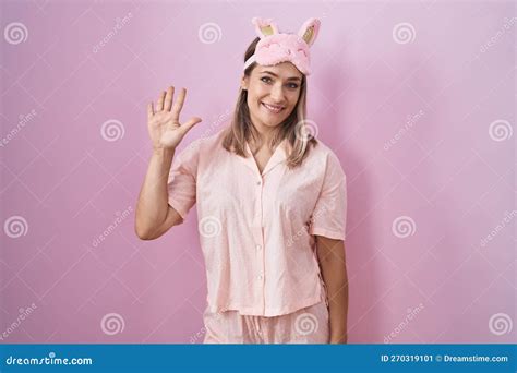 Blonde Caucasian Woman Wearing Sleep Mask And Pajama Showing And