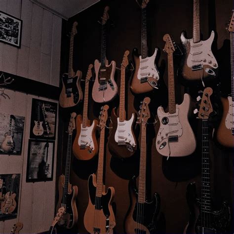 Guitars Are Lined Up On The Wall In A Room