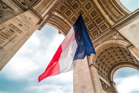 Arc De Triomphe With French Flag Stock Image - Image of champselysees, landmark: 30190683