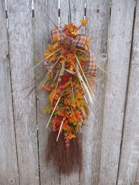 Handcrafted Straw Broom Provides Base For This Unique Fall Wreath Fall Greenery In Several