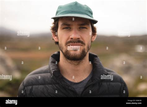 Close-up of confident man wearing cap Stock Photo - Alamy