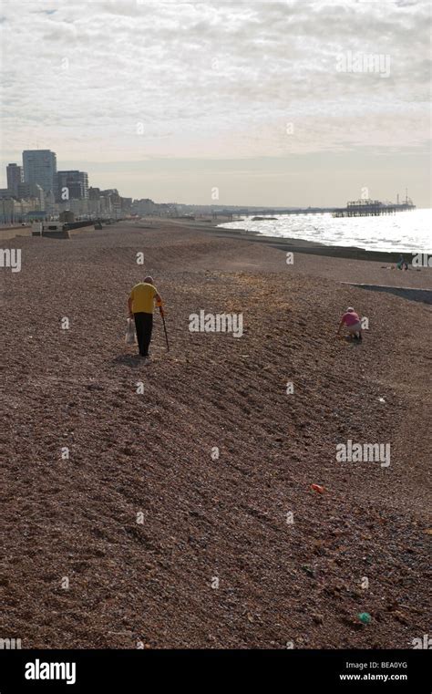 People Using Metal Detectors On A Beach Stock Photo Alamy