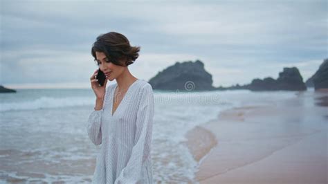 Outdoors Girl Talking Mobile At Rocky Beach Closeup Smiling Lady Looking Camera Stock Footage