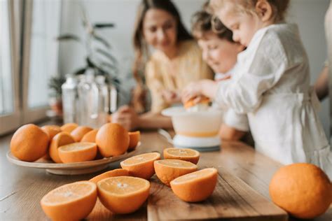 Kids Making Juice with Sliced Orange · Free Stock Photo