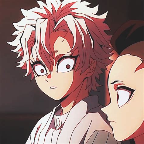 Two Anime Characters One With Red Hair And The Other White Staring At