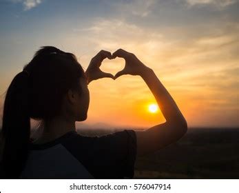 Woman Making Heart Hands Sunset Stock Photo (Edit Now) 576047914