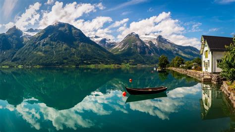 Boat On River With Reflection Of Mountains And Blue White Cloudy Sky Hd