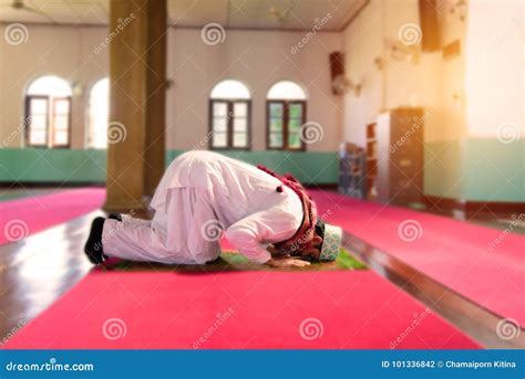 islam muslim man  custom dress praying  mosque stock photo image