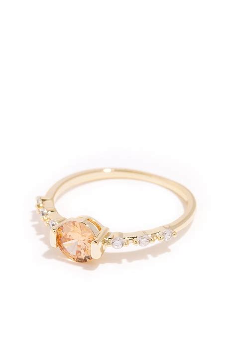 Gold Band Ring Featuring A Classic Peach Crystal Buttercup By Oomiay