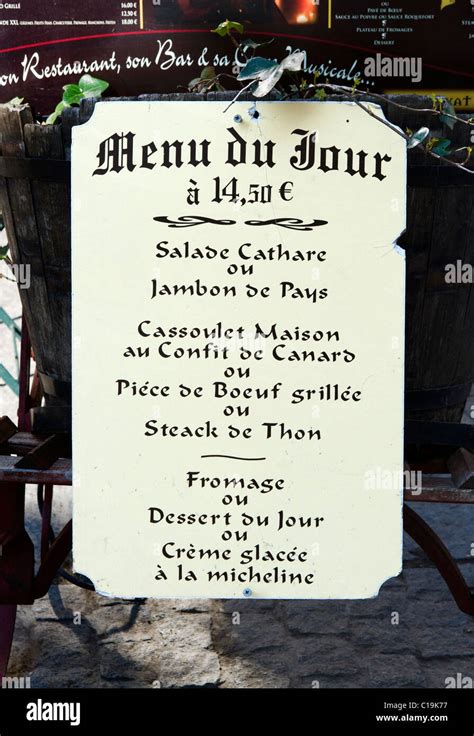 Menu board for the Menu du Jour outside a restaurant in the medieval ...