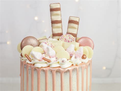 Rose Gold Drip Cake Topped With Treats Cakey Goodness