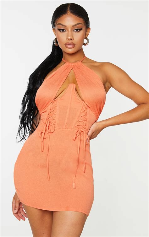 Robe Moulante Orange À Dos Nu Et Amatures Détail Corset