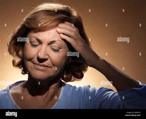 Woman with headache Stock Photo - Alamy