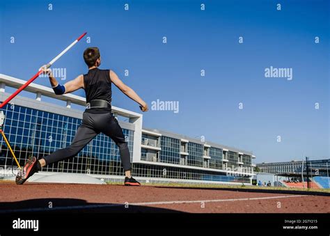 Male Athlete Javelin Throw At Track And Field Competition Stock Photo