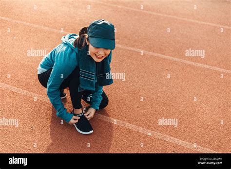 Woman Tying Shoe Laces Woman Fitness Runner Get Ready For Jogging On