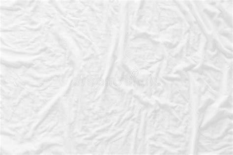 White Wrinkled Fabic Texture Close Up Unmade Bed Sheet In The Bedroom