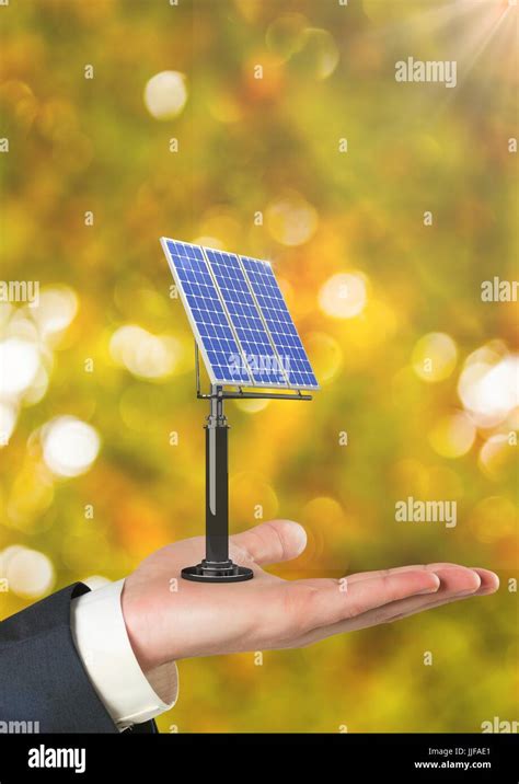 Digital Composite Of Cropped Hand Holding Solar Panel Against Defocused