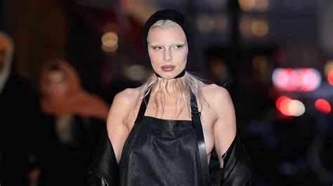 Julia Fox Flashes Major Side Boob In Apron Inspired Dress And Leather Trench Coat As She Steps