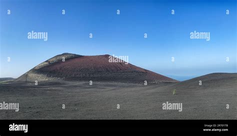 Cinder cone in place of fissure eruption. Monotonous slag field consists of pyroclastic debris ...