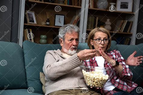 Mature Married Couple Entertaining Observing Terrified Tv Program Senior Husband And Wife