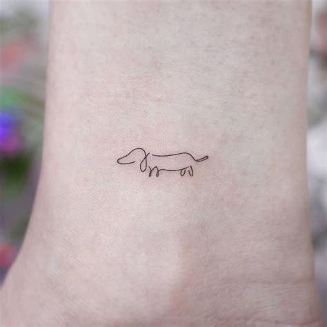 Simple Minimalist Dachshund Tattoo by @tattooist_namoo - Tattoogrid.net