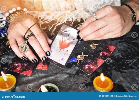 Show Fortune Tellers Of Hands Holding Tarot Cards And Tarot Reader With