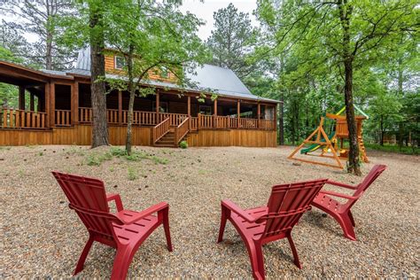 cabin exterior and Adirondack chairs - Blue Beaver Cabins