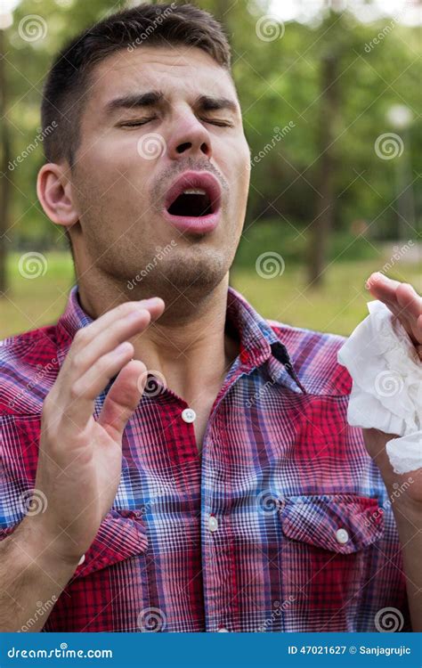 A Young Man With A Allergy Sneezing Stock Image Image Of Allergy