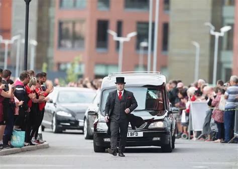 Barry Chuckle funeral: Heartbreaking pictures show brother Paul wipes away tears as he carries ...