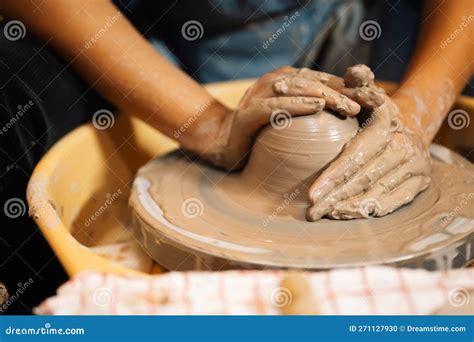 Close Up On Skillful Hands Sculpting Pottery Jar On Potter Wheel Stock