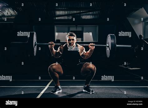 Sportsman Lifting A Barbell Stock Photo Alamy