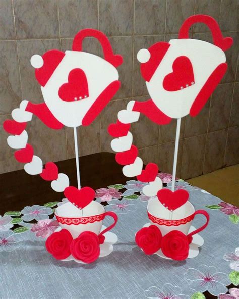 Two Red And White Cups With Hearts On Them