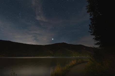 Premium Photo | Night scene pedestrian path on lake zywiec