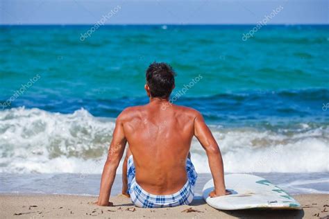 Man With His Surfboard On The Beach Stock Photo Mac Sim 76345541