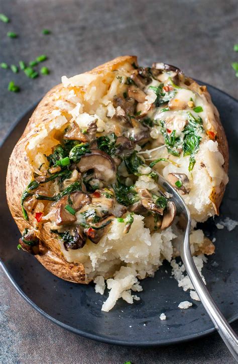 Cheesy Vegetarian Loaded Baked Potatoes With Spinach And Mushrooms