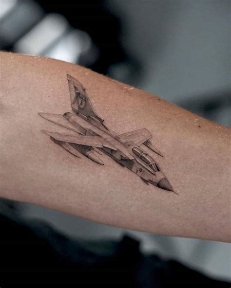 Micro-realistic style jet fighter tattoo located on the